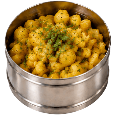 A dabba container of aloo curry
