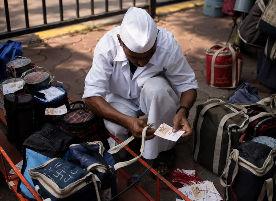 A Mumbai dabbawala at work