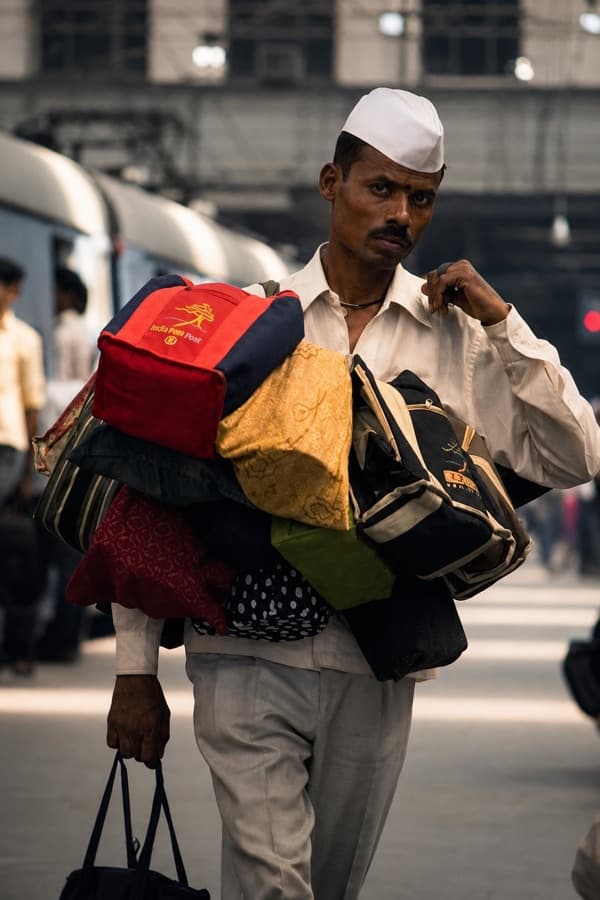 A Mumbai dabbawala at work
