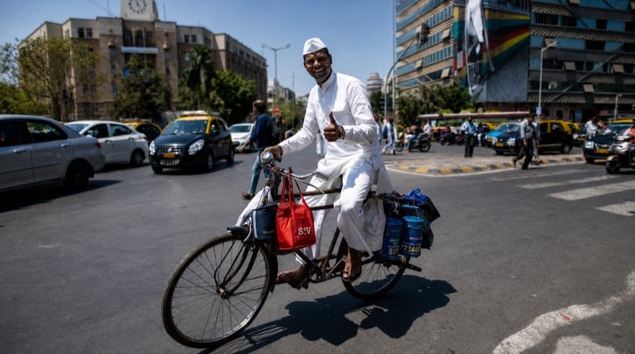A Mumbai dabbawala at work
