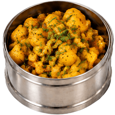 A dabba container of aloo curry