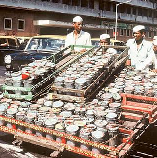 Rows of loaded tiffin carrier crates lined up on a Mumbai street, historical photo